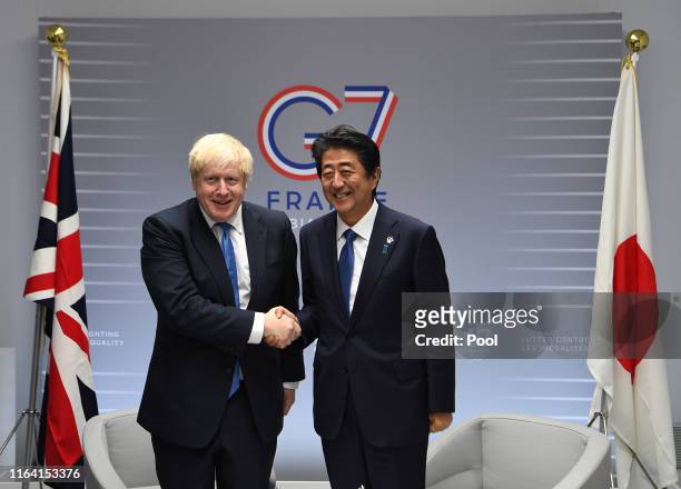 British Prime Minister Boris Johnson meets with Japanese Prime Minister Shinzo Abe on day three of the G7 Summit on August 26, 2019 in Biarritz,...