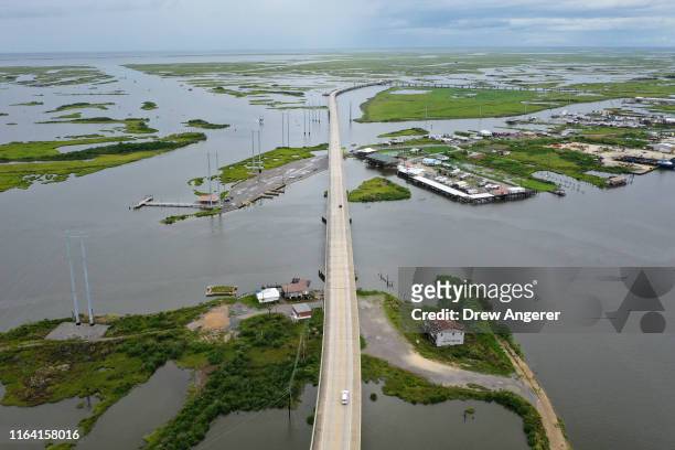 The Louisiana Highway 1 Bridge, also known as the Gateway to the Gulf Expressway, rises above the marshland and coastal waters on August 25, 2019 in...
