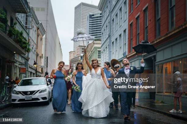 Wedding procession makes its way through the French Quarter on August 25, 2019 in New Orleans, Louisiana. According to researchers at the National...