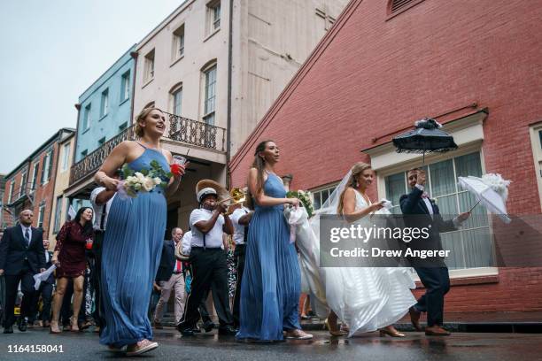 Wedding procession makes its way through the French Quarter on August 25, 2019 in New Orleans, Louisiana. According to researchers at the National...