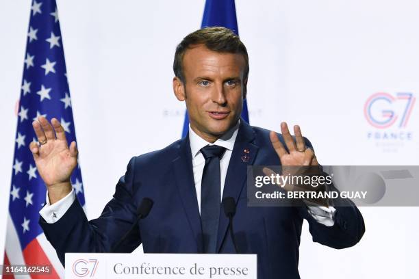 France's President Emmanuel Macron gives a joint-press conference with the US president in Biarritz, south-west France on August 26 on the third day...