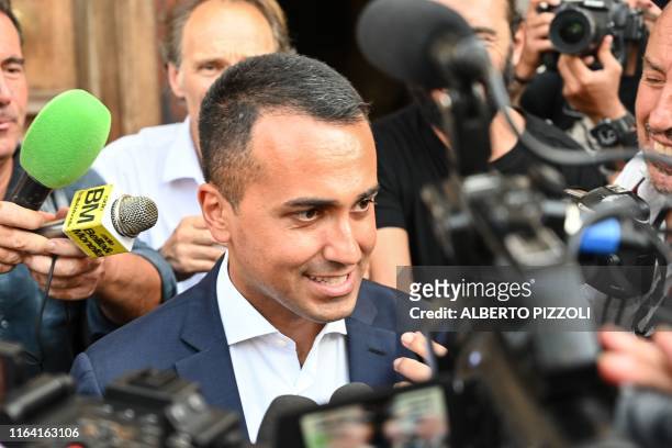 Italys Labor and Industry Minister and deputy PM Luigi Di Maio faces reporters as he leaves following a meeting with the M5S movement on August 26,...