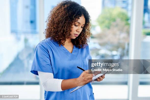 checking up on a few patient files - medical document stock pictures, royalty-free photos & images