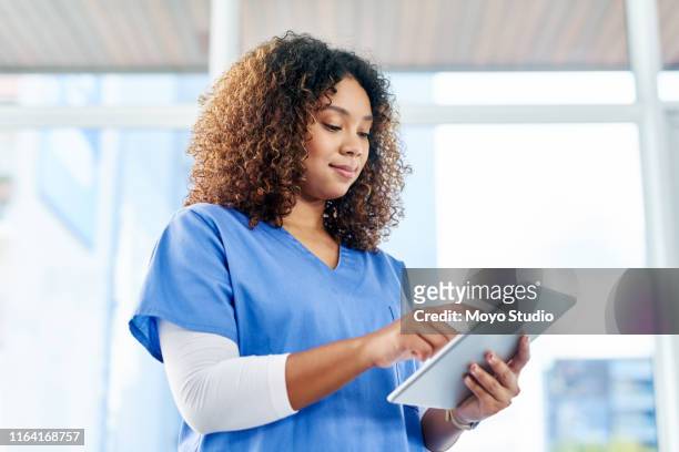 what's trending in the medical world today - female nurse stock pictures, royalty-free photos & images