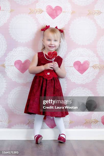 valentine's day beauty in red dress - red dress child stockfoto's en -beelden