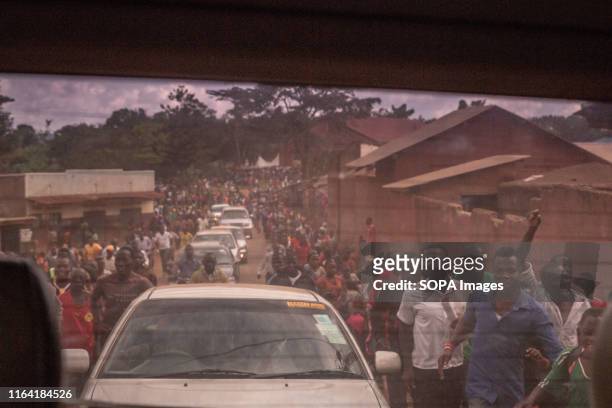 Convoy of cars and supporters of Bobi Wine, during a campaign event in Gombe. Bobi Wine, whose real name is Robert Kyagulanyi, a popstar and...
