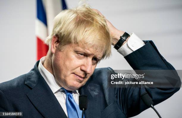 August 2019, France , Biarritz: Boris Johnson, Prime Minister of Great Britain, is driving through his hair during the final press conference of the...