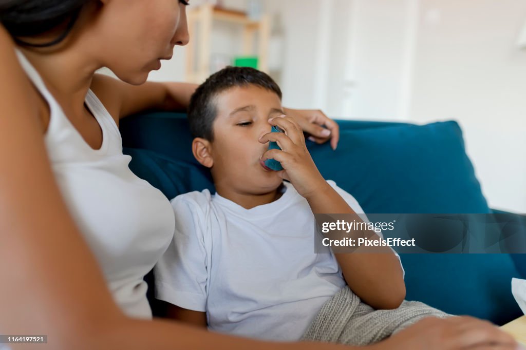 Boy Using Asthma Inhaler