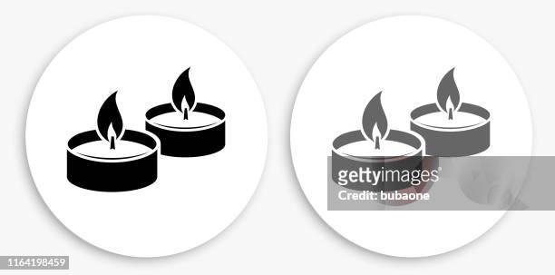 candle fire black and white round icon - candle stock illustrations