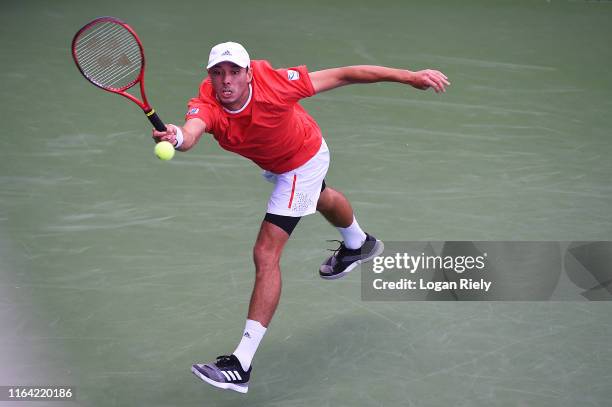 Ben McLachlan of Japan returns a forehand to Jack Sock and Jackson Withrow during the BB&T Atlanta Open at Atlantic Station on July 25, 2019 in...