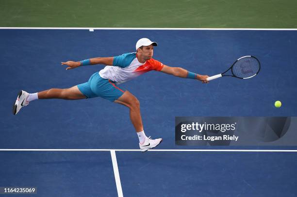 Kevin King returns a forehand to Taylor Fritz during the BB&T Atlanta Open at Atlantic Station on July 25, 2019 in Atlanta, Georgia.