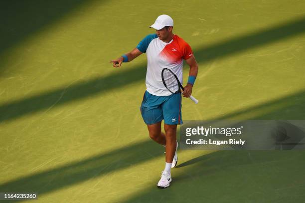 Kevin King points for a towel during his match against Taylor Fritz during the BB&T Atlanta Open at Atlantic Station on July 25, 2019 in Atlanta,...