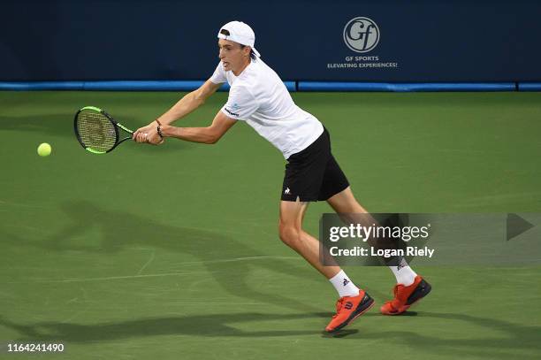 Ugo Humbert of France returns a backhand to Miomir Kecmanovic of Serbia during the BB&T Atlanta Open at Atlantic Station on July 25, 2019 in Atlanta,...