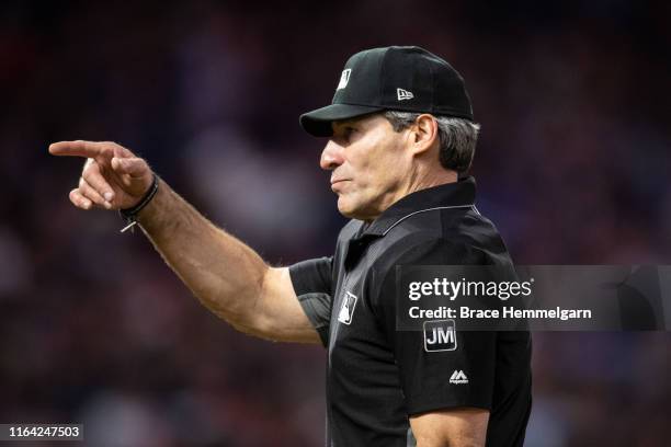 Umpire Angel Hernandez gestures during a game between the Minnesota Twins and Kansas City Royals on June 15, 2019 at the Target Field in Minneapolis,...