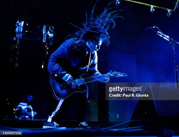 James Shaffer of KoRn performs on stage at Ameris Bank Amphitheatre on July 25, 2019 in Alpharetta, Georgia.