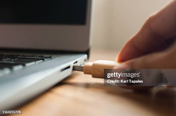Laptop With Usb Cable Photos and Premium High Res Pictures - Getty Images