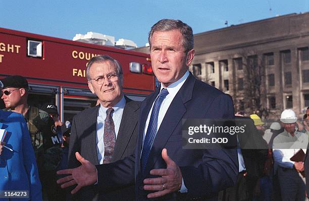 ,President George W. Bush visits the Pentagon September 12, 2001 in Arlington, Virginia. Bush, joined by Secretary of Defense Donald Rumsfeld...