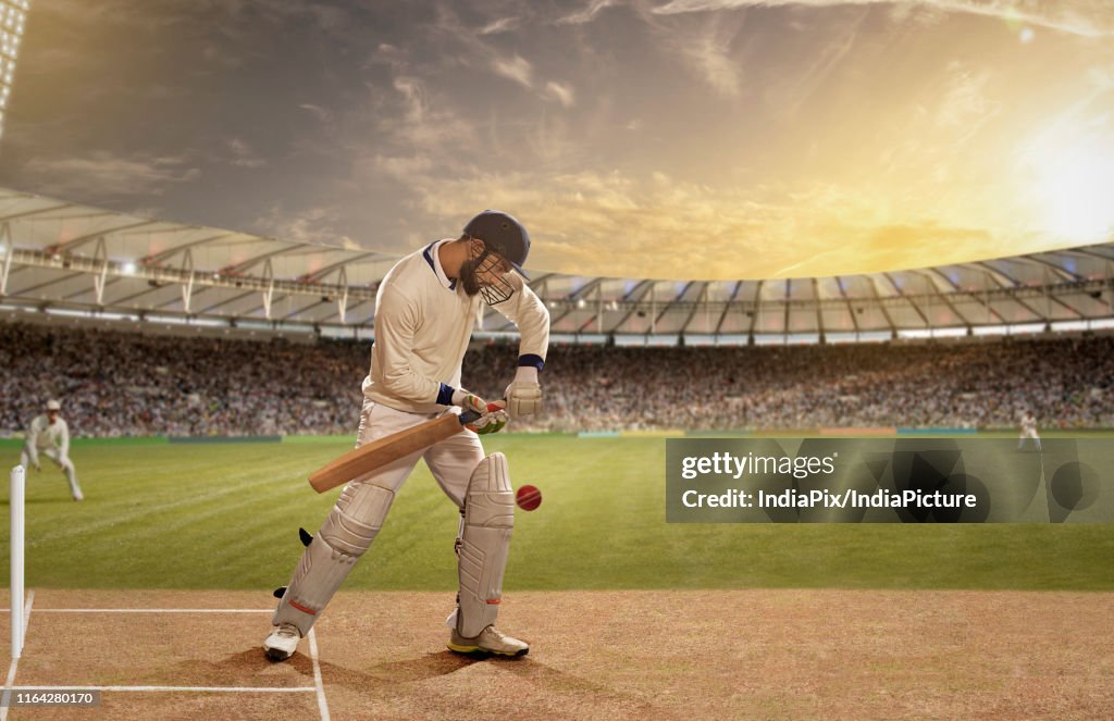 Batsman in action in a Cricket match