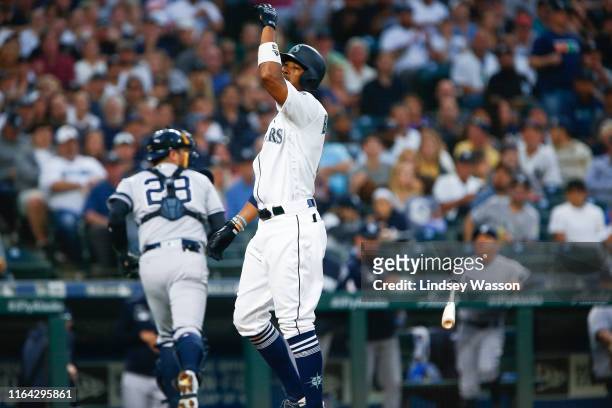 Keon Broxton of the Seattle Mariners throws his bat after striking out to end the second inning, leading to an ejection after hitting home plate...