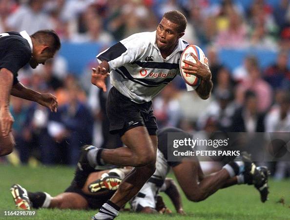 Fiji's Saimoni Rokini fights off New Zealand's Eric Rush at the Hong ...