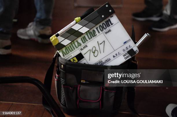 The clapperboard is tidy-up in a bag on the set of an Eurogroup meeting during the filming of Greek French director Costa-Gavras new movie called...