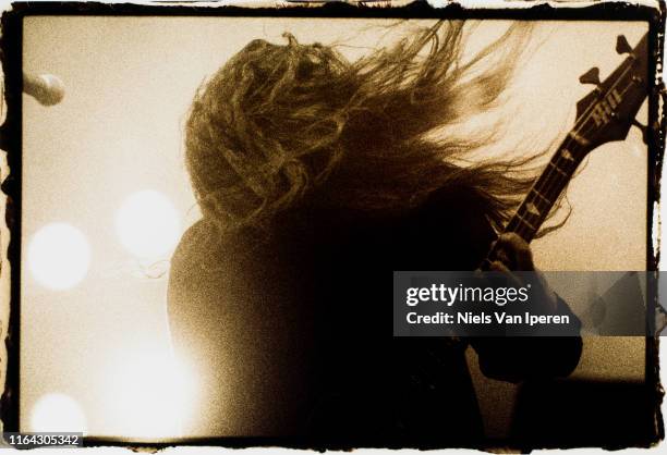 Tom Araya, Slayer, performing on stage, Groenoordhal, Leiden, Netherlands, 30th September 1990.