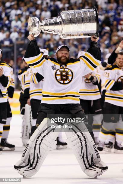 Tim Thomas of the Boston Bruins celebrates with the Stanley Cup after defeating the Vancouver Canucks in Game Seven of the 2011 NHL Stanley Cup Final...