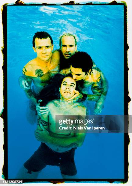 Red Hot Chili Peppers, portrait, posed in a swimming pool, Sunset Marquee, Los Angeles, CA, 18th August 1995.