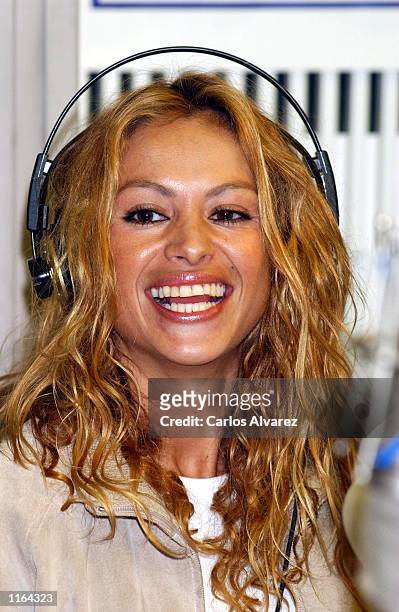Mexican singer Paulina Rubio smiles during an interview at the Cadena Dial radio station to promote her new tour September 19, 2001 in Madrid, Spain.