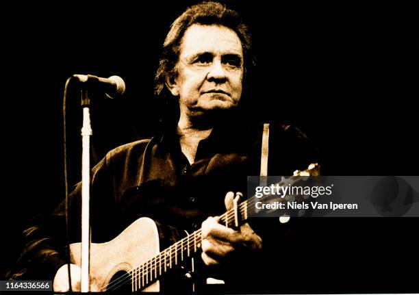 Johnny Cash, performing on stage, Glastonbury Festival, United Kingdom, 26th June 1994.