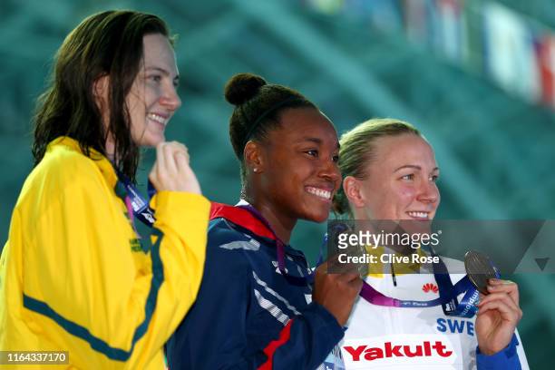 Silver medalist Cate Campbell of Australia, gold medalist Simone Manuel of the United States and bronze medalist Sarah Sjostrom of Sweden pose during...