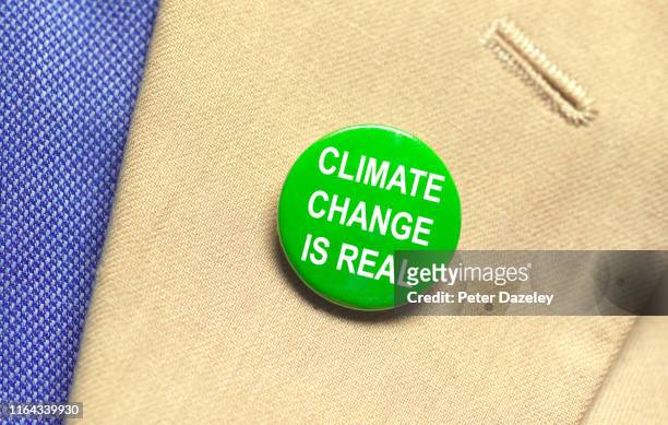 climate change believer - campaign button stock pictures, royalty-free photos & images