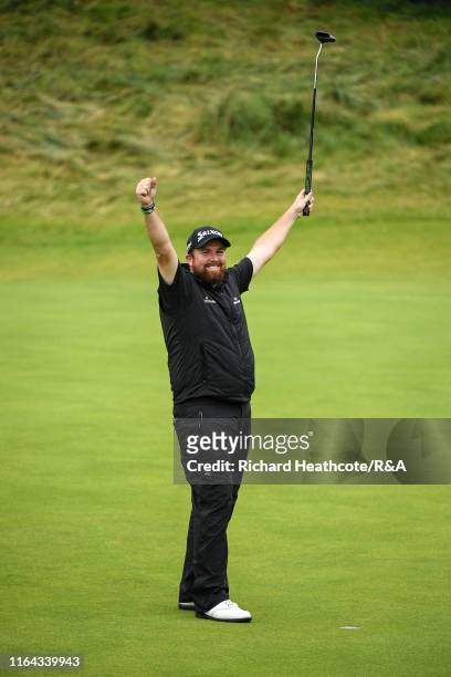 Shane Lowry of Ireland celebrates as he holes the winning putt, securing victory during the final round of the 148th Open Championship held on the...