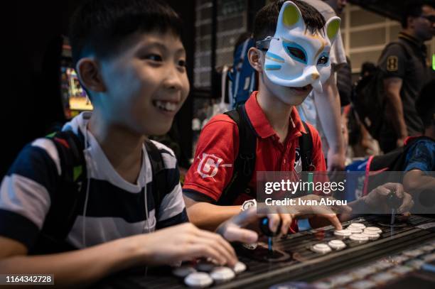 Kids play a retro game during the E-Sports and Music Festival Hong Kong 2019 on July 28, 2019 in Hong Kong, China.