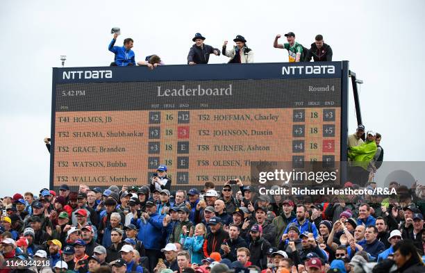 Spectators cheer on Shane Lowry on the 16th green during the final round of the 148th Open Championship held on the Dunluce Links at Royal Portrush...