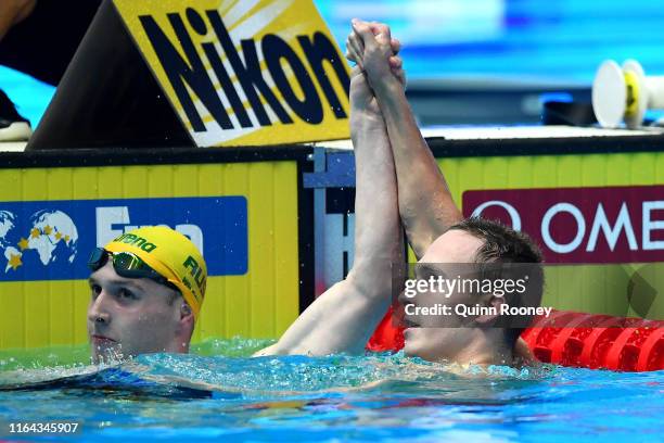 Anton Chupkov of Russia is congratulated by Matthew Wilson of Australia after setting a new world record of 2:06.12 in the Men's 200m Breaststroke...