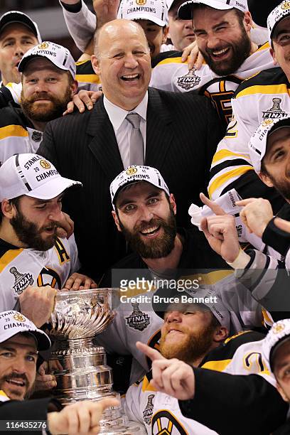 Head coach Claude Julien, Tim Thomas, Patrice Bergeron, Mark Recchi, Shawn Thornton, and Zdeno Chara of the Boston Bruins pose with the Stanley Cup...