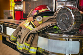 Firefighter protection gear on the fire truck bumper