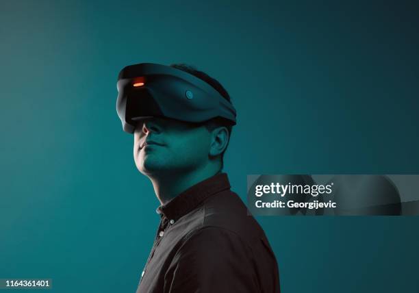 virtual reality device - virtual reality simulator stock pictures, royalty-free photos & images