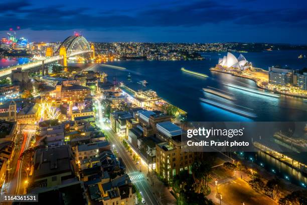 waterfront city skyline of sydney city downtown in twilight night with  modern architectural landmarks in sydney, australia. - circular quay stock-fotos und bilder