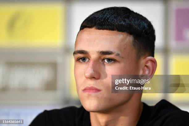 Phil Foden of Manchester City looks on during a Manchester City press conference and training at the Nissan Stadium on July 26, 2019 in Yokohama,...