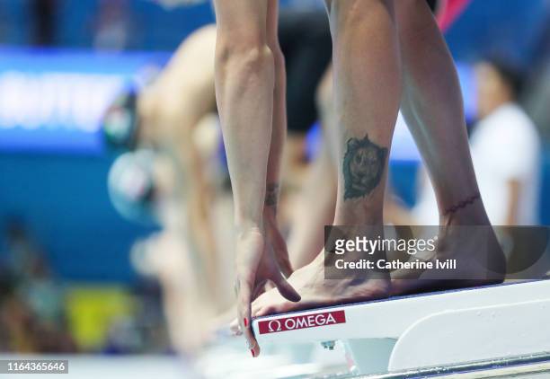 The tattoo on Beatrix Bordas of Hungary as she prepares to compete in the Women'a 50m Butterfly heats during day six of the Gwangju 2019 FINA World...