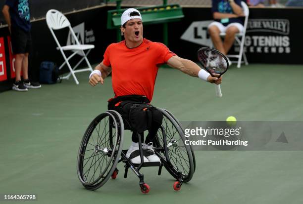 Gustavo Fernandez of Argentina celebrates winning a point during his match against Gordon Reid of Great Britain on day four of the LTA British Open...