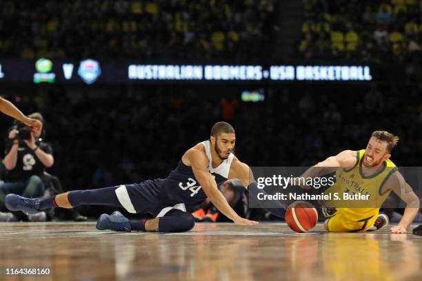 Jayson Tatum of USA fights for the ball against Nick Kay of the Australia Boomers on August 24, 2019 at Marvel Stadium in Melbourne, Australia. NOTE...