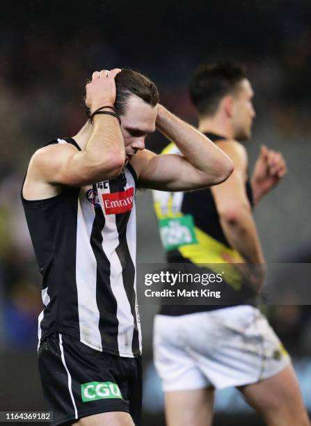 Matthew Scharenberg of the Magpies looks dejected after the round 19 AFL match between the Collingwood Magpies and the Richmond Tigers at Melbourne...