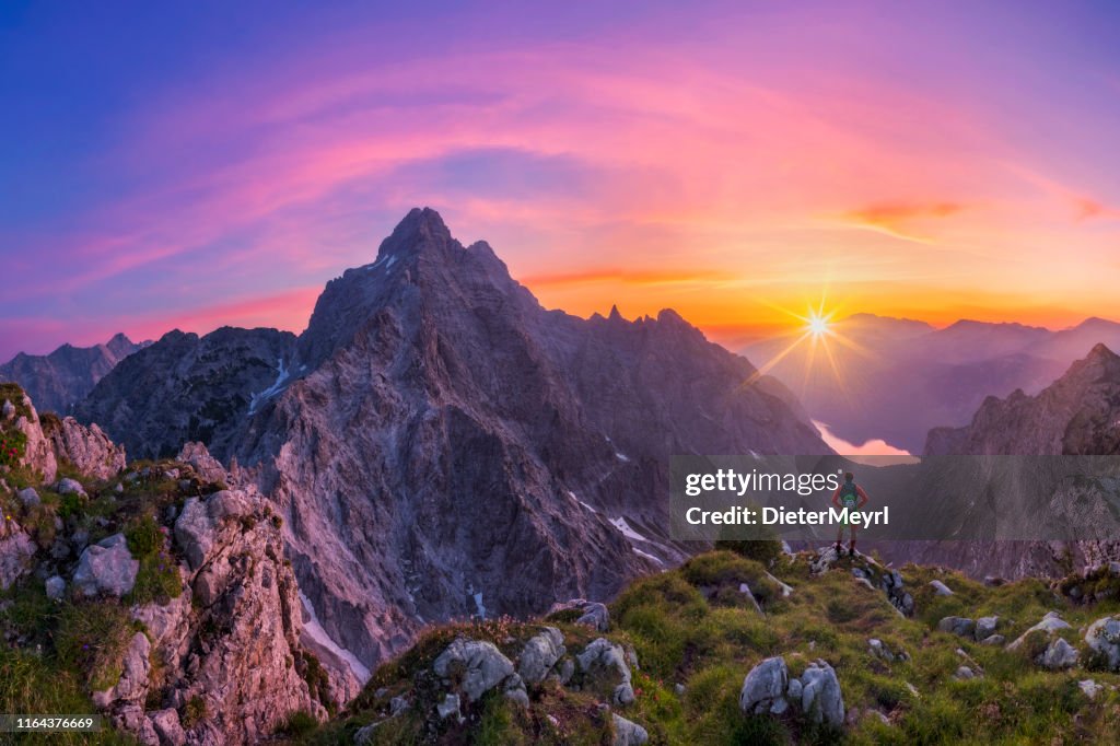 Hiker at glory sunrise with view to Watzmann and Königssee, Nationalpark Berchtesgaden