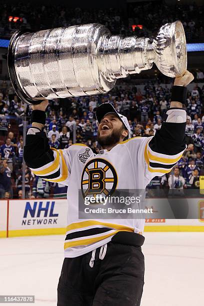 David Krejci of the Boston Bruins celebrates with the Stanley Cup after defeating the Vancouver Canucks in Game Seven of the 2011 NHL Stanley Cup...