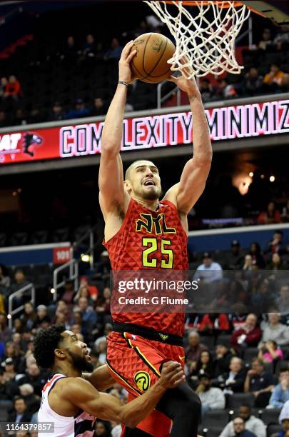 Alex Len of the Atlanta Hawks dunks the ball against the Washington Wizards at Capital One Arena on February 4, 2019 in Washington, DC.