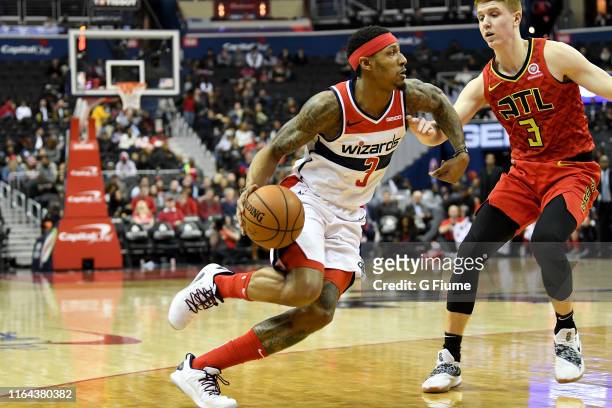 Bradley Beal of the Washington Wizards handles the ball against Kevin Huerter of the Atlanta Hawks at Capital One Arena on February 4, 2019 in...