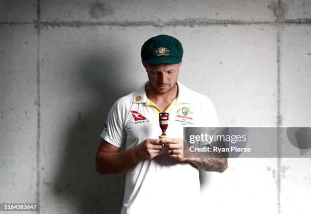 James Pattinson of Australia poses with a replica Ashes Urn after the Australia Ashes Squad Announcement at The Ageas Bowl on July 26, 2019 in...